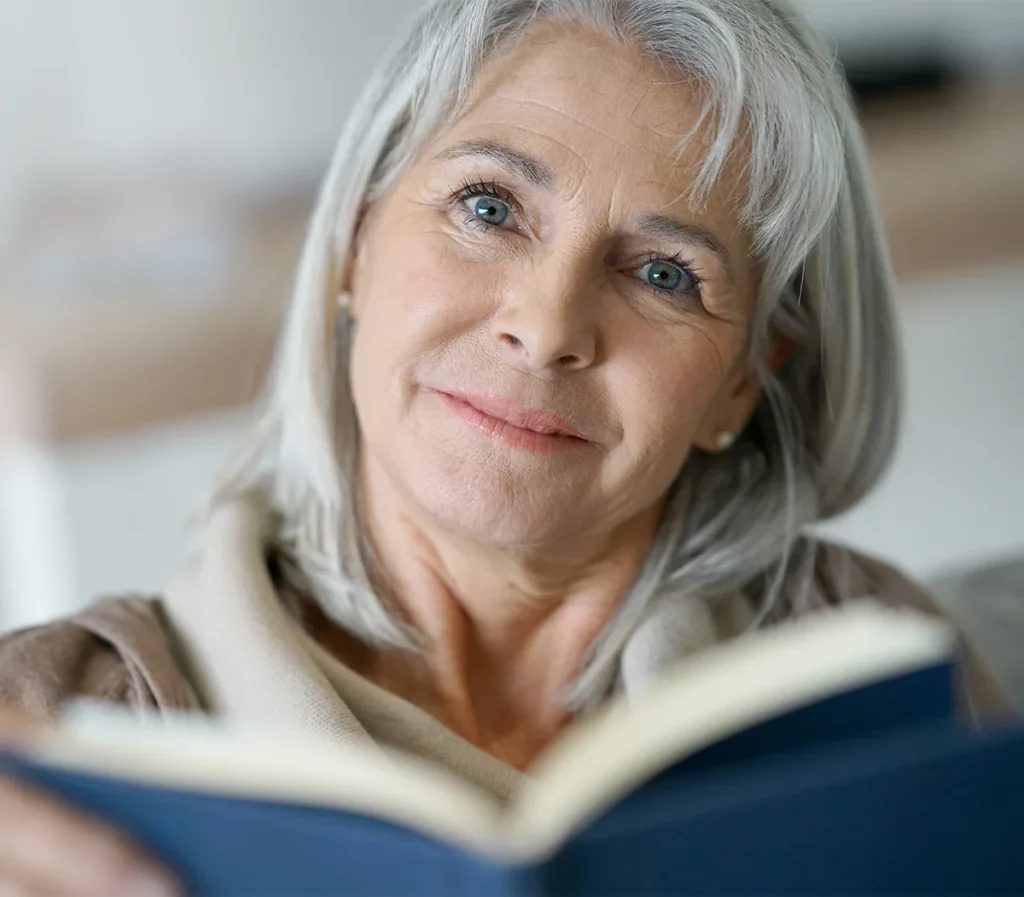 senior woman reading a book